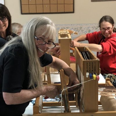 Beginning Weaving Class Participants Warp Their Looms