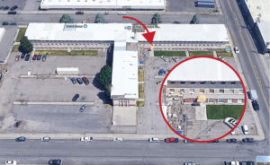 An overhead image of the building the Studio is in, with an arrow pointing to the Studio location and a more closeup view in a circle on the lower right of the image.